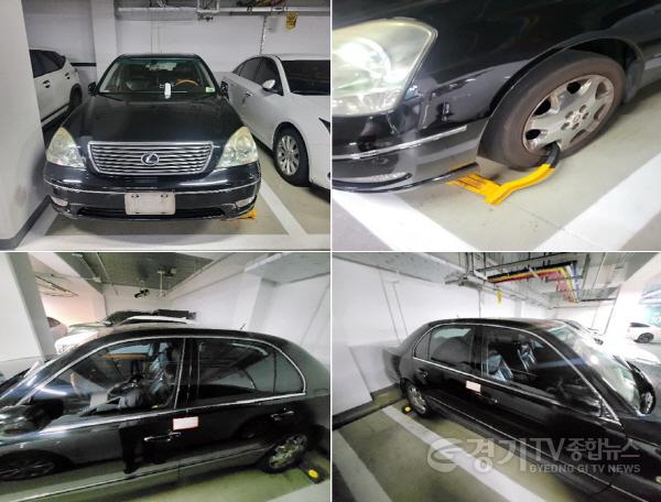 [크기변환]5. 시가 공동주택 주차장에서 대포차량을 발견하고 실 사용자 확인을 위해 번호판을 영치하고, 족쇄 설치, 압류봉인지를 부착한 모습..jpg